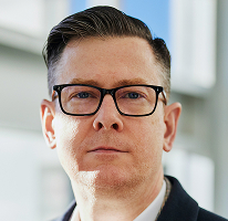 Alexander Hughes, chief executive officer heading a crypto trading company, executive portrait